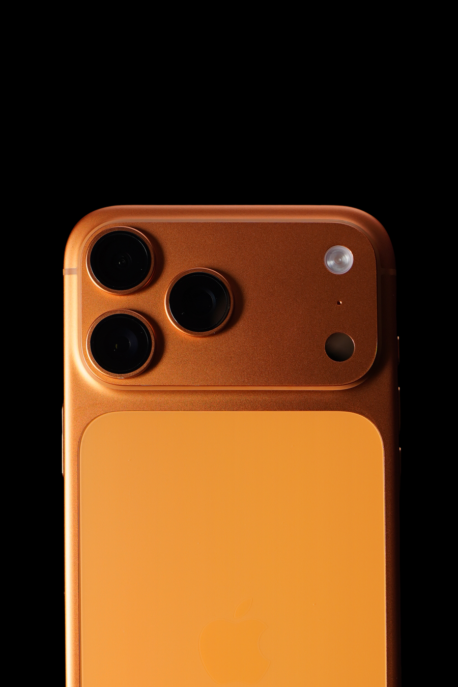 iPhone 17 Pro Max in cosmic orange, back and camera, photographed at Walker Wireless