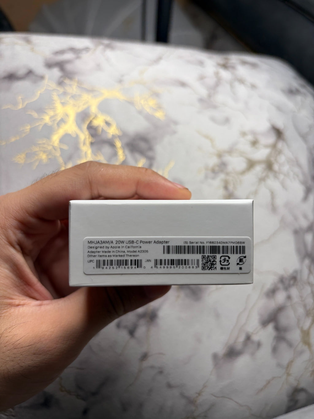 Actual box label showing Apple 20W USB-C Power Adapter model A2305 and part number MHJA3AM/A